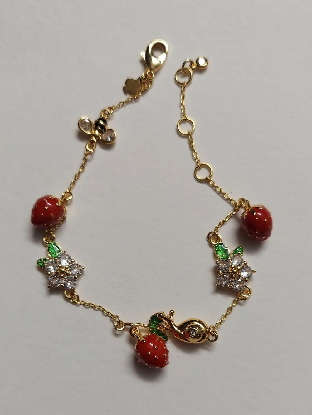 kate spade Gold-Tone Strawberry Charm Bracelet with Red and Green Accents - Picture 4 of 8